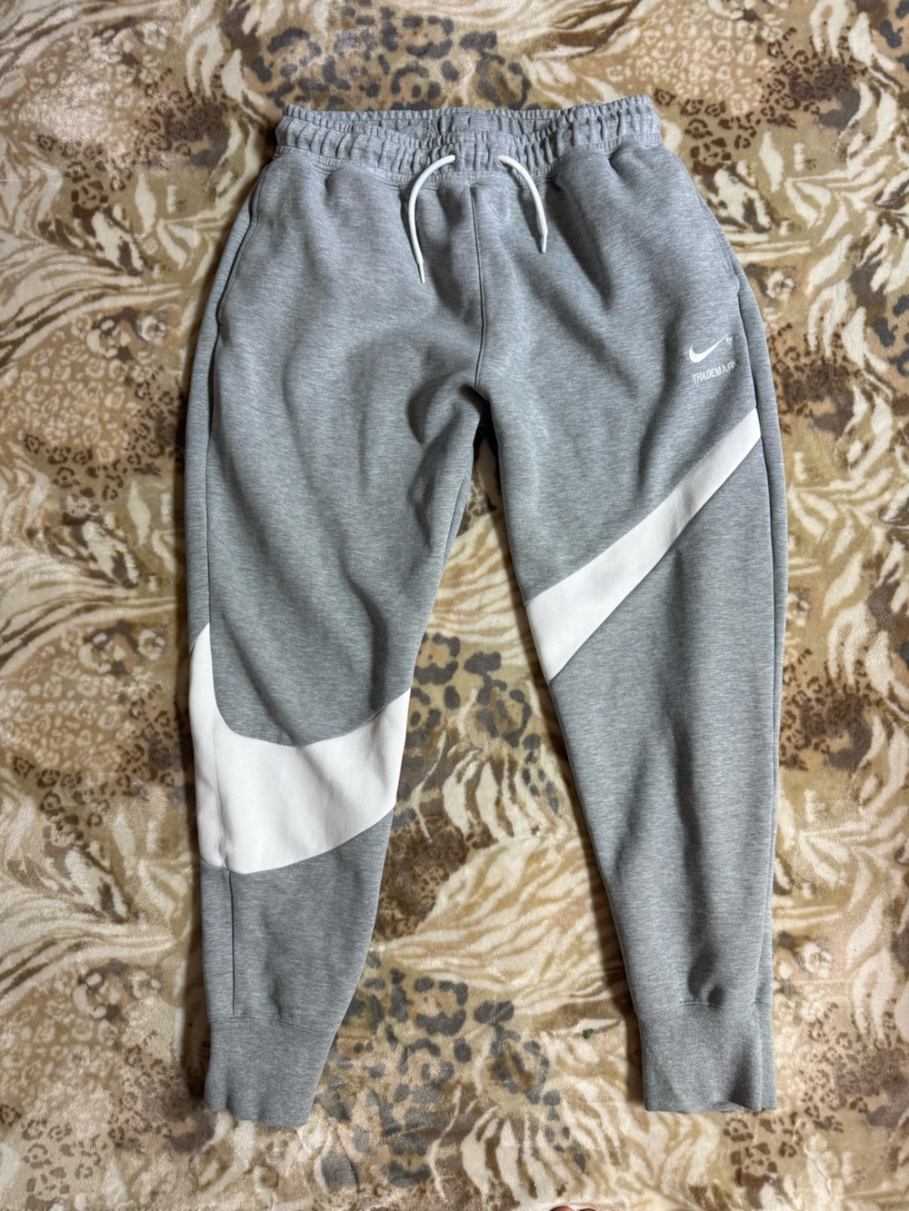 Gray Nike sweatpants with white diagonal stripes, size M #athletic #loungewear